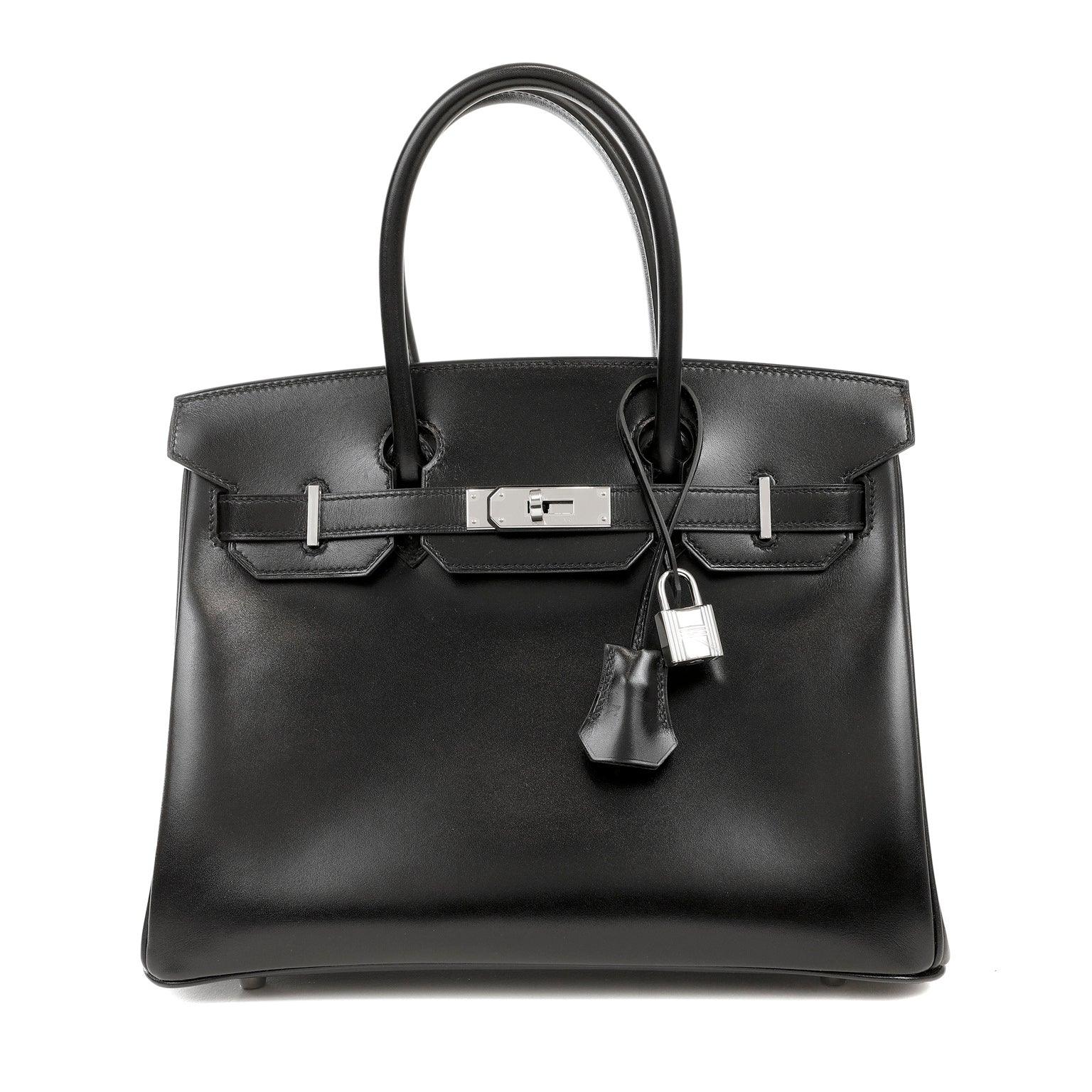 This exquisite Hermès Birkin is crafted from sleek black box calf