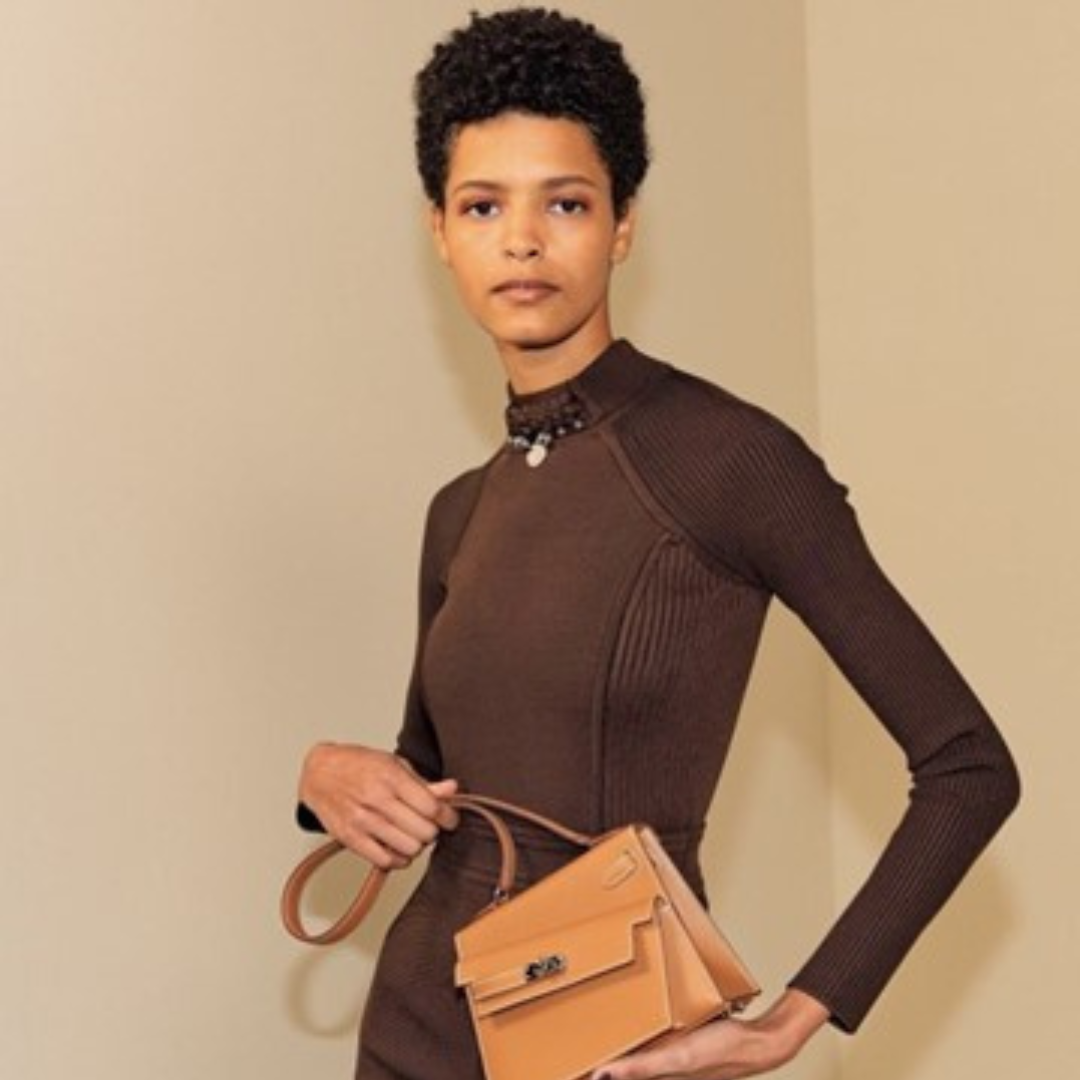 orange-iconic 	26.	ALT Text: “Hermes Garden Party 36 Bag in Beige Canvas