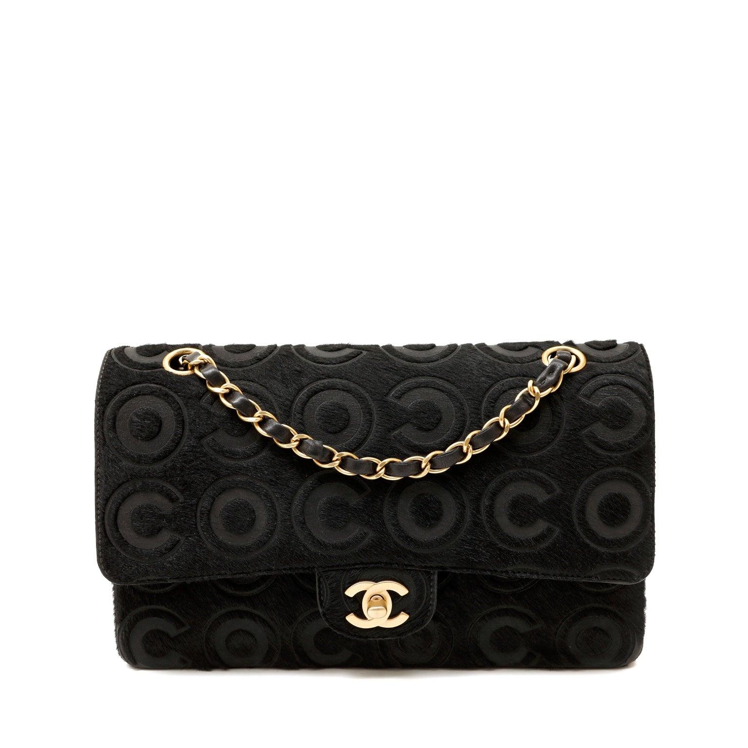 Classic Chanel Black Quilted Leather Flap Bag”
