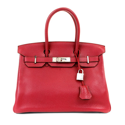 This exceptional Hermès 30 cm Maroon Togo Birkin bag boasts unparalleled luxury and quality