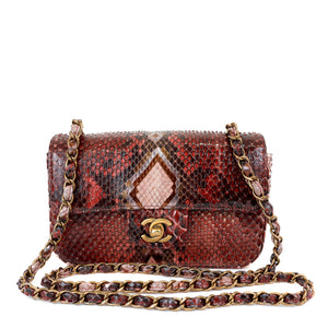 Elevate your style with this exquisite Chanel Burgundy Python Small Classic Flap bag