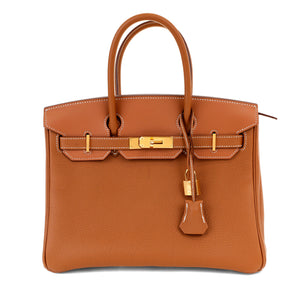 The "Hermès 30cm Gold Togo 3 in 1 Birkin Bag" is a handbag from the luxury brand Hermès
