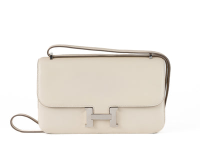 Look no further than this authentic Hermès 25 cm Cream Swift Constance Elan