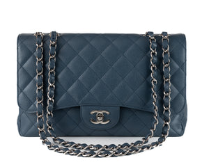Introducing the authentic Chanel Navy Caviar Jumbo Classic Flap Bag in pristine condition