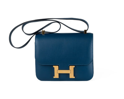 The Hermès 24 cm Blue Evergrain Constance with Gold Hardware is a beautiful and sophisticated handbag that is perfect for those who appreciate quality craftsmanship and timeless design