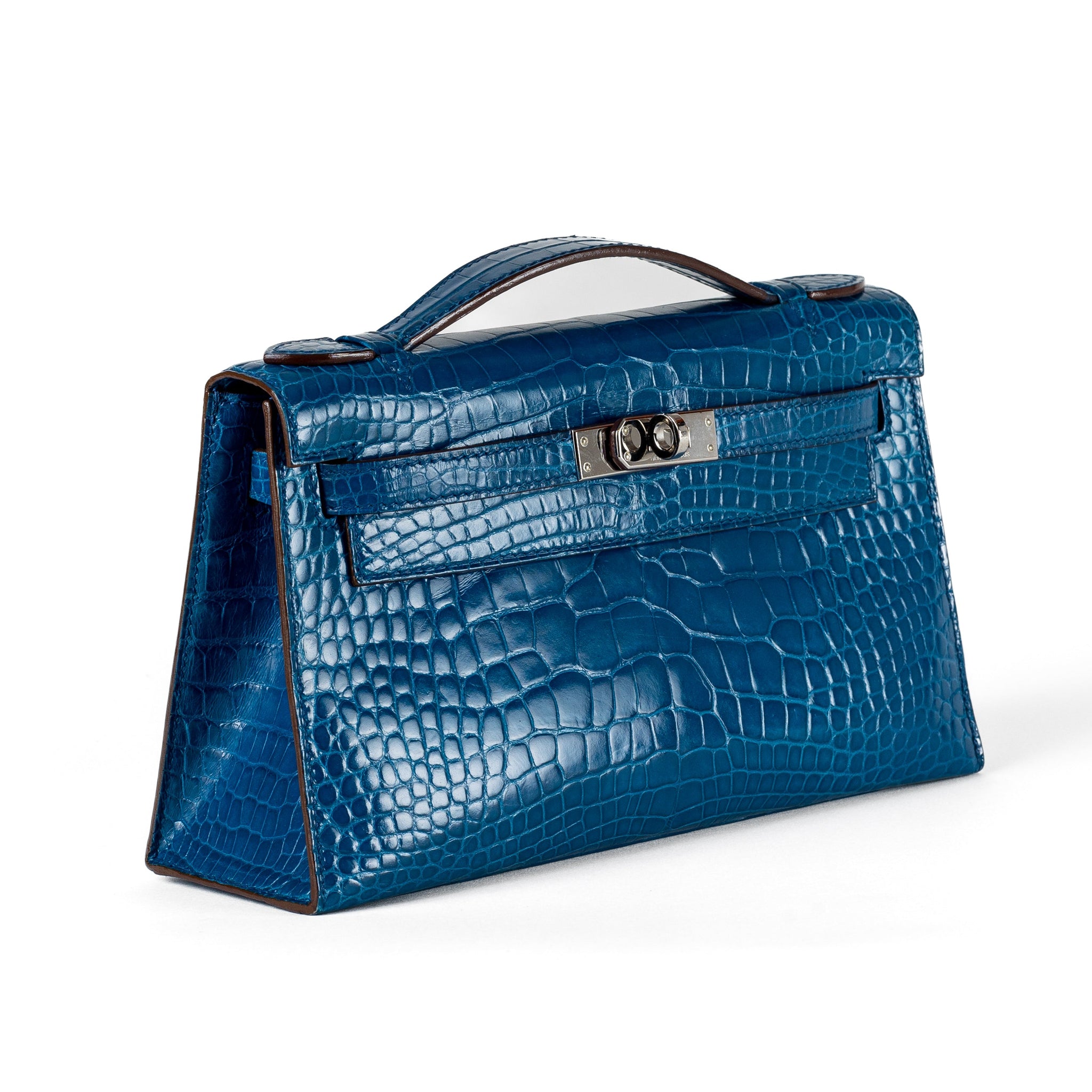 Indulge in ultimate luxury with the Hermès Blue Porosus Croc Kelly Pouchette, finished with sleek palladium hardware