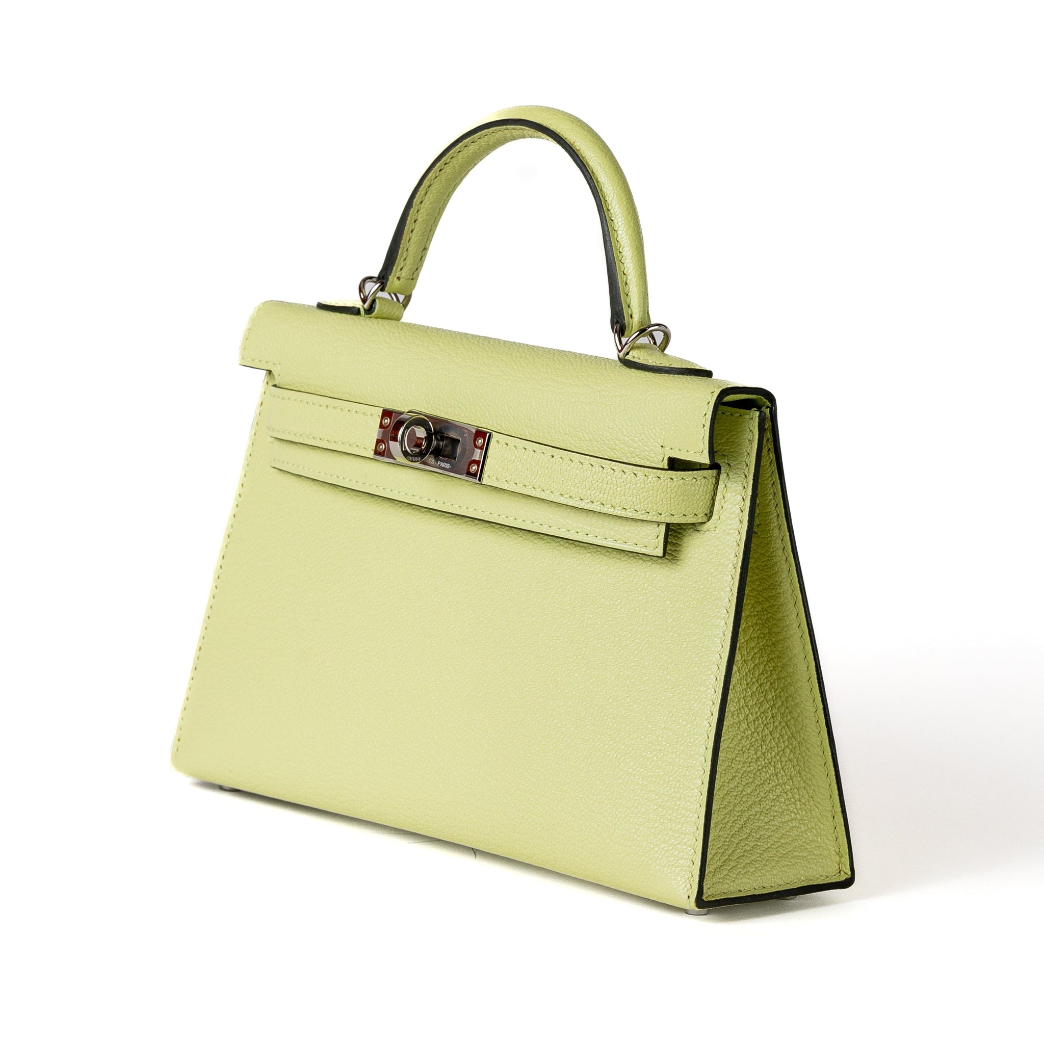 Introducing the Hermès 20cm Light Mint Green Chevre Mini Kelly, finished with sleek palladium hardware