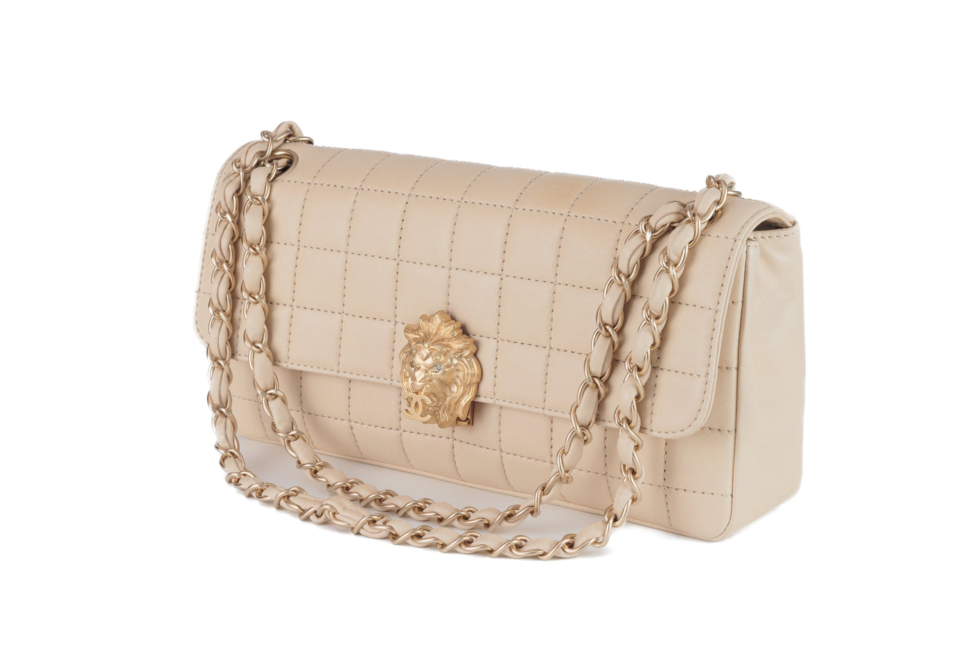 Looking for a rare and unique Chanel bag for your collection? This  authentic Chanel Ivory Lambskin Chocolate Bar Quilted Flap Bag with Gold  Lion Head Clasp – Only Authentics