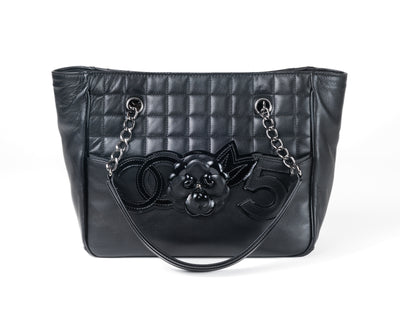 This Chanel Black Lambskin Camellia Mini Shopper is a must-have classic for collectors