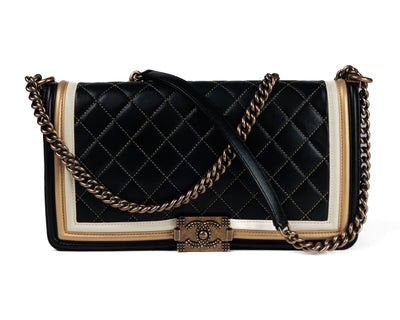 Check out this authentic Chanel Black Leather Tri Color Medium Boy Bag! Crafted in pristine condition